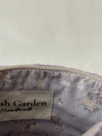 Pochette trousse de maquillage violet pastel lila en crochet fait main 100% coton et tissu fleuri